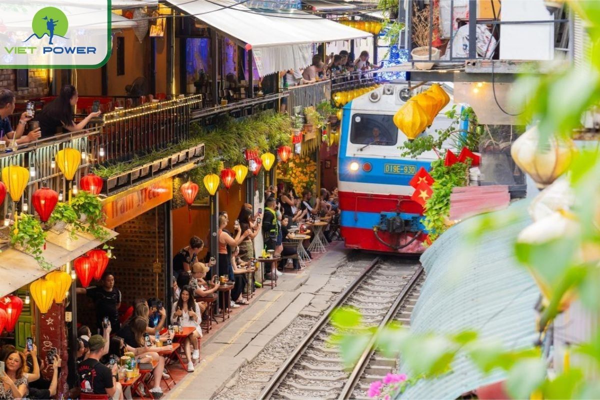 Relax with a coffee and watch the train pass by the small houses